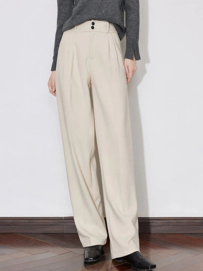 Front view of ivory wide-leg trousers with grey sweater and black shoes