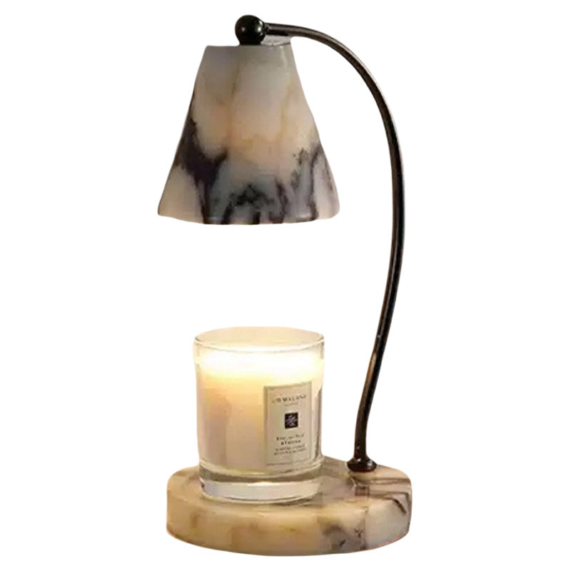 Marble bedside lamp with integrated candle tray and curved metal arm