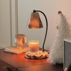 Marble bedside lamp with integrated candle tray and curved metal arm