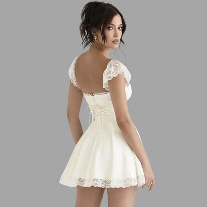 Sylis | Dress with lace appliques and flowy skirt